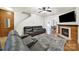 Spacious living room featuring hardwood floors, a cozy fireplace, and ample seating space at 2117 Seabrook Ln, Fort Mill, SC 29715