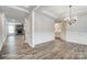 Open dining area featuring hardwood floors, elegant lighting, and decorative wall trim at 2232 Tabor Rd # 570, Sherrills Ford, NC 28673