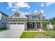 Beautiful two-story home showcasing a blend of stone and siding exterior, plus a two car garage at 2232 Tabor Rd # 570, Sherrills Ford, NC 28673