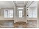 Welcoming foyer showcasing hardwood floors and elegant trim detail, leading to various rooms at 2232 Tabor Rd # 570, Sherrills Ford, NC 28673