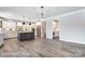 Open concept kitchen with white cabinets, hardwood floors, and a large island at 2232 Tabor Rd # 570, Sherrills Ford, NC 28673