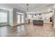 Open concept kitchen featuring an island with white cabinets, stainless steel appliances, and hardwood floors at 2232 Tabor Rd # 570, Sherrills Ford, NC 28673