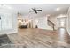 Open-concept living room with hardwood floors leading to the kitchen and staircase at 2232 Tabor Rd # 570, Sherrills Ford, NC 28673