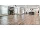Open-concept living room featuring hardwood floors, stone fireplace, and a spacious kitchen at 2232 Tabor Rd # 570, Sherrills Ford, NC 28673