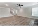 Spacious living room with modern hardwood floors, staircase access, and neutral paint colors at 2232 Tabor Rd # 570, Sherrills Ford, NC 28673