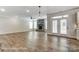 Spacious living room with hardwood floors, fireplace, and access to the kitchen and outdoor area at 2232 Tabor Rd # 570, Sherrills Ford, NC 28673