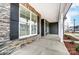 Inviting front porch featuring stone accents, sturdy columns, and a smooth concrete floor at 2232 Tabor Rd # 570, Sherrills Ford, NC 28673