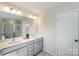 Bright bathroom with double sink vanity, and a large mirror at 2636 Tillman St, Monroe, NC 28112