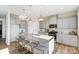Modern kitchen features gray cabinets, granite countertops, a large island, and stainless appliances at 2636 Tillman St, Monroe, NC 28112