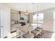 Modern kitchen with gray cabinetry, granite countertops, a large island, and stainless appliances at 2636 Tillman St, Monroe, NC 28112