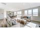 Spacious living area with large windows, seamlessly connected to the dining area and kitchen at 2636 Tillman St, Monroe, NC 28112