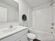 Clean bathroom featuring white vanity, tub with shower, and a decorative wall hanging at 2678 Wedgewood Ct, Denver, NC 28037