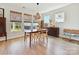 Cozy dining room with wood floors, natural light, and casual furnishings for a comfortable meal at 2678 Wedgewood Ct, Denver, NC 28037