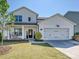 Charming two-story home features a well-manicured lawn, a cozy front porch, and a convenient two-car garage at 2678 Wedgewood Ct, Denver, NC 28037