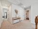 Upstairs hallway featuring a console table and a view to bedrooms and bathrooms at 2678 Wedgewood Ct, Denver, NC 28037