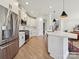 Modern kitchen featuring stainless steel appliances, white cabinetry, a kitchen island and sleek finishes at 2678 Wedgewood Ct, Denver, NC 28037