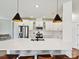 Stylish kitchen with quartz countertops, a modern faucet, a subway tile backsplash, and stainless steel appliances at 2678 Wedgewood Ct, Denver, NC 28037