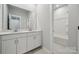 Modern bathroom features a double vanity and a separate shower/tub at 3042 Finchborough Ct # 235, Charlotte, NC 28269