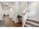 Bright entryway features hardwood floors, carpeted stairs, and modern finishes at 3042 Finchborough Ct # 235, Charlotte, NC 28269