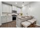This modern kitchen features white cabinets, granite countertops, and stainless steel appliances at 3042 Finchborough Ct # 235, Charlotte, NC 28269