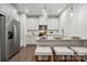 This modern kitchen features white cabinets, granite countertops, and stainless steel appliances at 3042 Finchborough Ct # 235, Charlotte, NC 28269