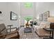 Open-concept living room featuring high ceilings, modern furniture, and natural light at 3042 Finchborough Ct # 235, Charlotte, NC 28269
