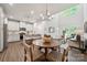 Open living space with modern decor, hardwood floors, and plenty of natural light at 3042 Finchborough Ct # 235, Charlotte, NC 28269