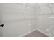 A tidy walk-in closet with shelving and storage solutions to keep your wardrobe organized at 3042 Finchborough Ct # 235, Charlotte, NC 28269