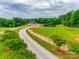 Aerial view of a property with large barn and white fencing outlining the property at 3091 Old Meeting House Rd, Sharon, SC 29742