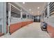 Horse barn featuring stalls with metal gates and a concrete floor at 3091 Old Meeting House Rd, Sharon, SC 29742