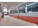 Horse barn featuring stalls with metal gates and a concrete floor at 3091 Old Meeting House Rd, Sharon, SC 29742