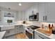 Well-lit kitchen featuring granite countertops, subway tile backsplash, and stainless steel appliances at 3091 Old Meeting House Rd, Sharon, SC 29742