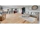 Open-concept living space with hardwood floors, a cozy sofa, and a kitchen with a large center island at 3091 Old Meeting House Rd, Sharon, SC 29742