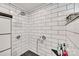 Modern shower with white subway tile, dark stone floor, and sleek fixtures at 3091 Old Meeting House Rd, Sharon, SC 29742