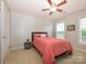 Relaxing bedroom featuring light walls, a black bed frame, and windows with natural light at 3224 Dunbar Ln, Fort Mill, SC 29707