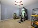 Versatile bedroom space with exercise equipment and terrariums for reptile pets at 3224 Dunbar Ln, Fort Mill, SC 29707