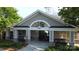 View of the clubhouse entrance with stone pillars, seating, and architectural detailing at 3224 Dunbar Ln, Fort Mill, SC 29707