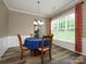 Cozy dining room with natural light, classic wooden table, and an open airy feel at 3224 Dunbar Ln, Fort Mill, SC 29707