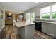 Kitchen with an island, sliding door to patio and open concept to living room and dining area at 3224 Dunbar Ln, Fort Mill, SC 29707