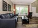 Bright living room with hardwood floors, modern decor and a comfortable seating area at 3224 Dunbar Ln, Fort Mill, SC 29707