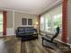 Well-lit living room featuring modern furniture, and large windows at 3224 Dunbar Ln, Fort Mill, SC 29707