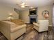 Comfortable living room with fireplace, ceiling fan, and plush furniture, perfect for relaxation at 3224 Dunbar Ln, Fort Mill, SC 29707