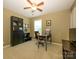 Functional office space with a large bookcase and dark wooden desk, bathed in natural light at 3224 Dunbar Ln, Fort Mill, SC 29707