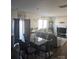 A dining room that transitions to the living room, featuring modern decor, ample seating, and natural light at 324 Gaines Rd # 8, Clover, SC 29710
