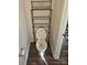 Efficient half bathroom with toilet and overhead shelving for storage at 324 Gaines Rd # 8, Clover, SC 29710