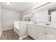 Bathroom featuring double sinks and garden tub at 3312 James Rd, Charlotte, NC 28215