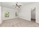 Bedroom with carpet, ceiling fan, and walk-in closet at 3312 James Rd, Charlotte, NC 28215