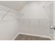 Walk-in closet with white wire shelving and neutral carpeting at 3312 James Rd, Charlotte, NC 28215