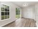 Dining area featuring modern flooring and a sliding door leading to the backyard at 3312 James Rd, Charlotte, NC 28215