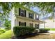 Inviting two-story home with a covered front porch and well-maintained landscaping at 3312 James Rd, Charlotte, NC 28215